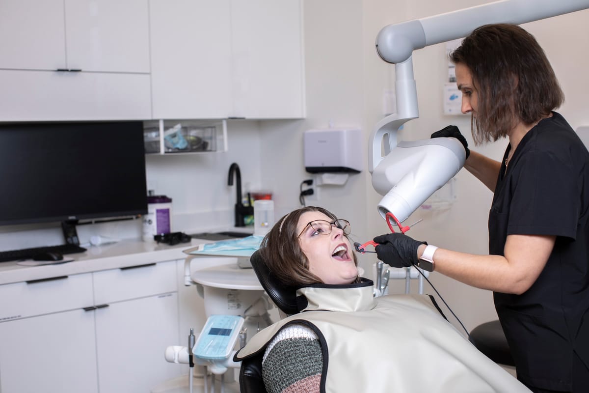 Patient receiving a 3D CT scan during full-arch implant consultation at Fusion Dental Implants