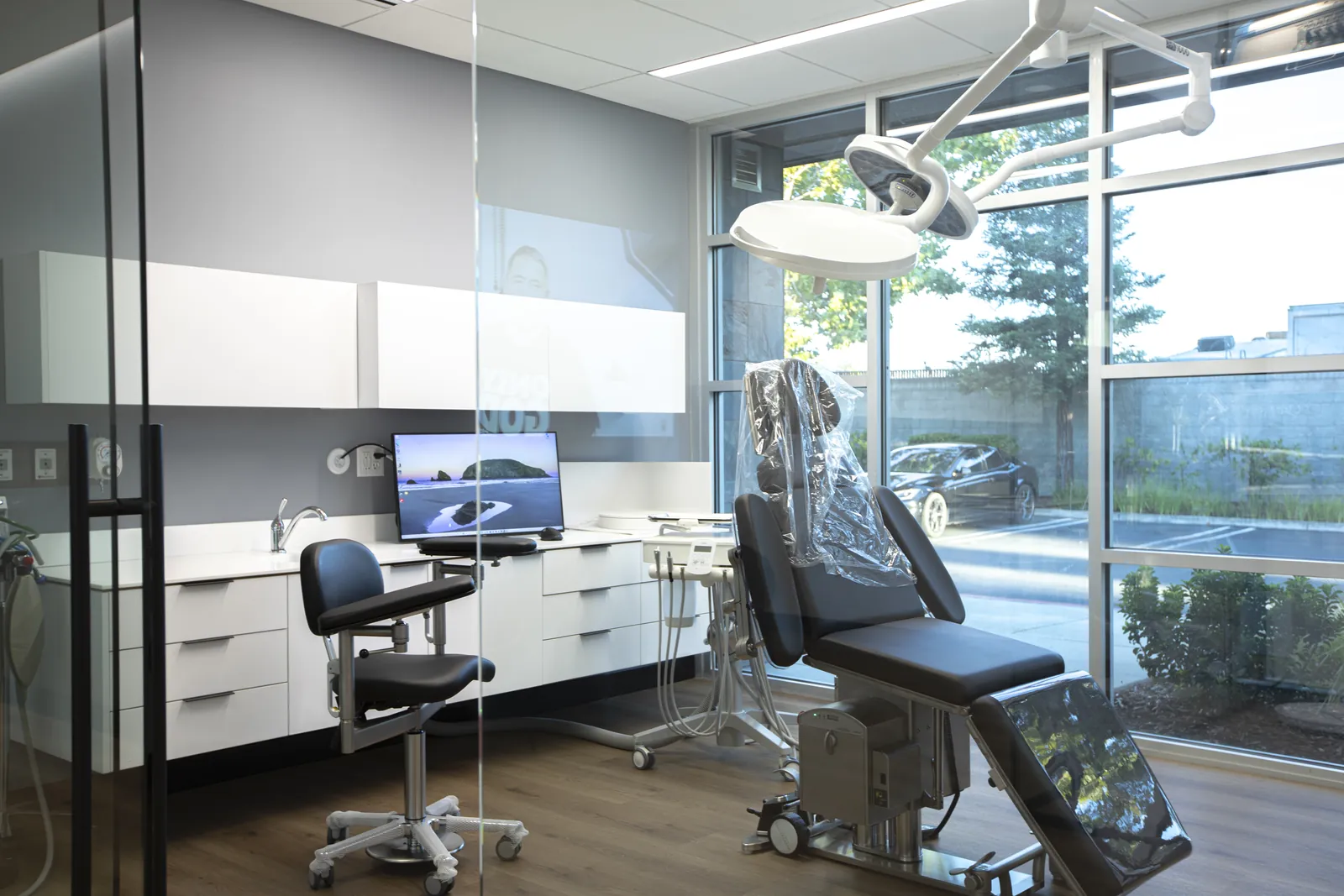 Dental treatment room with patient chair and cabinetry